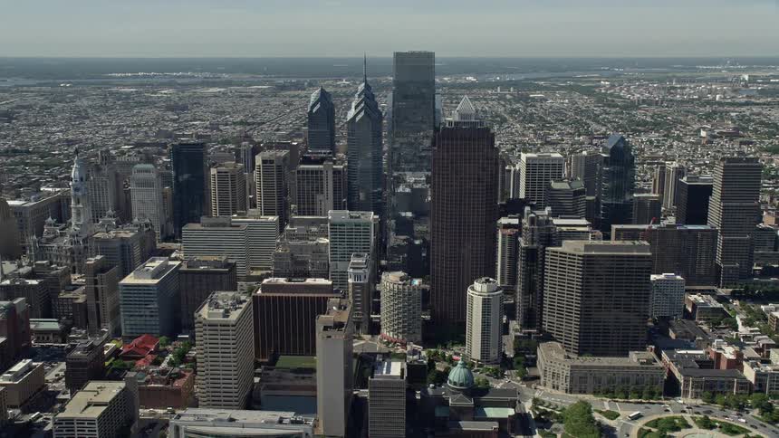 A stunning aerial view of the towering skyscrapers in downtown Philadelphia on a sunny day
