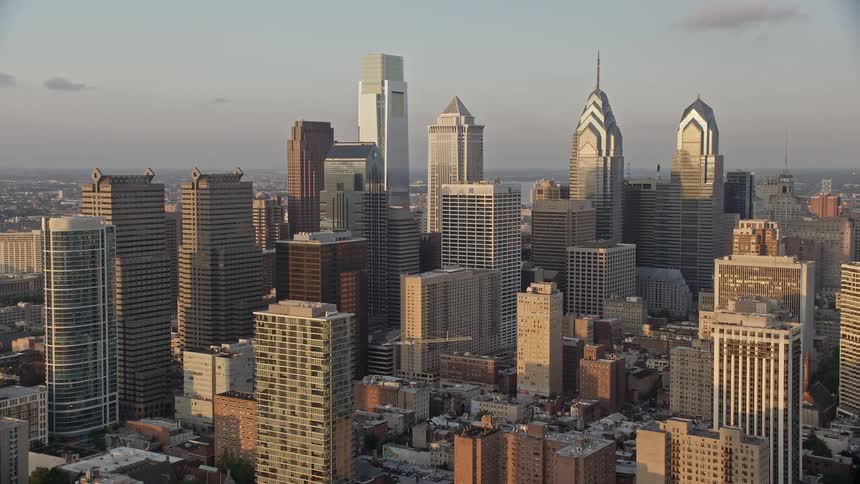 An aerial view of Downtown Philadelphias high rises and urban neighborhoods during sunset