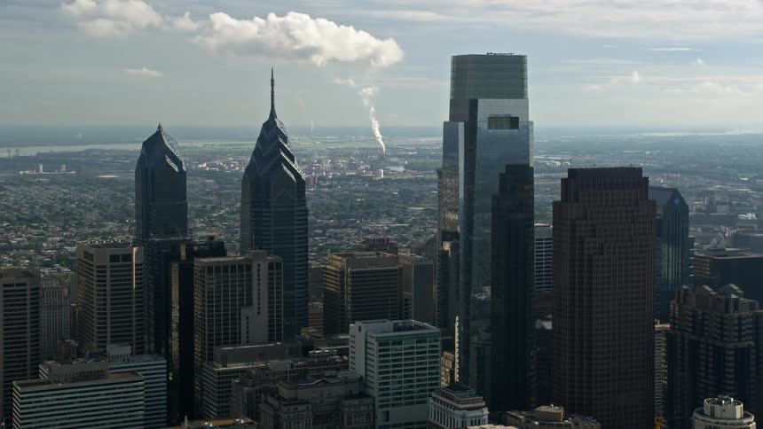 Aerial view of One and Two Liberty Place Comcast Center and Three Logan Square in downtown Philadelphia Pennsylvania on a hazy day