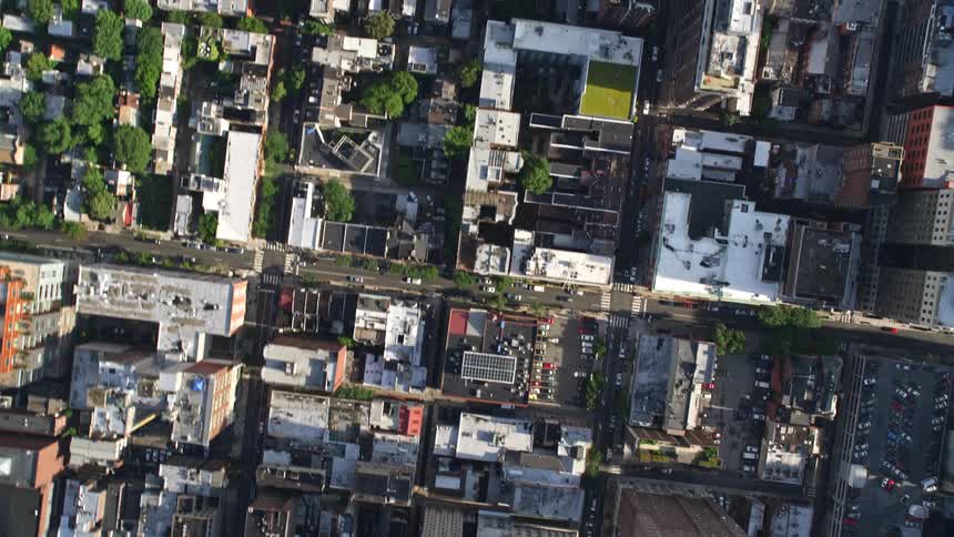 A birds eye view of urban residential areas downtown areas and city streets in Philadelphia Pennsylvania on a partly cloudy day