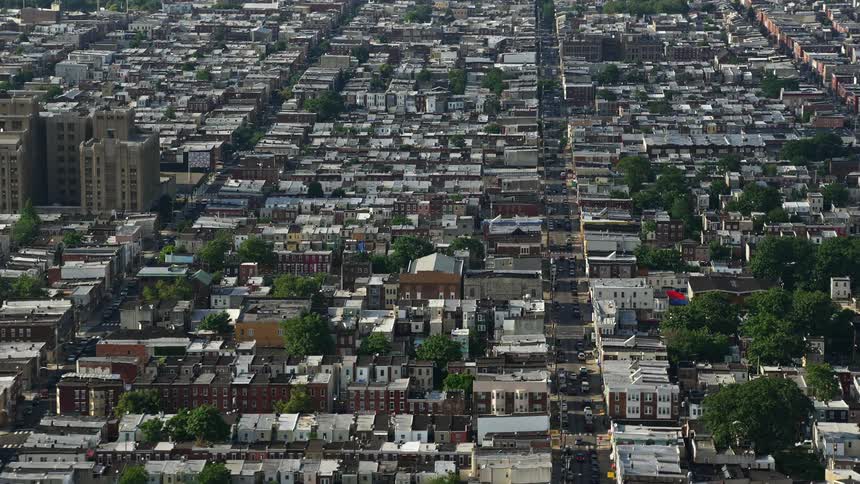 Aerial view of South Philadelphias S 7th Street and urban neighborhoods on a partly cloudy day