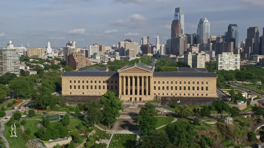 Aerial footage of the Philadelphia Museum of Art and the Downtown Philadelphia skyline captured in resolution on a partly cloudy day