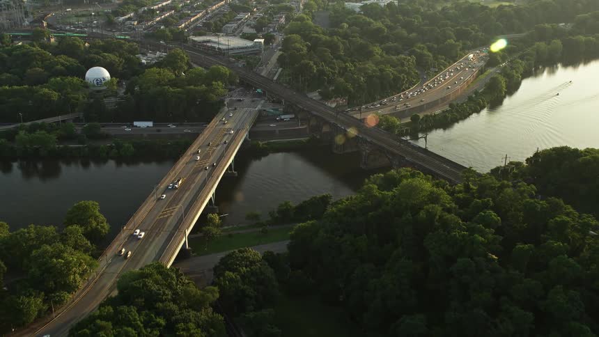 Aerial footage approaching the Girard Bridge at sunset spanning the Schuylkill River in Philadelphia Pennsylvania