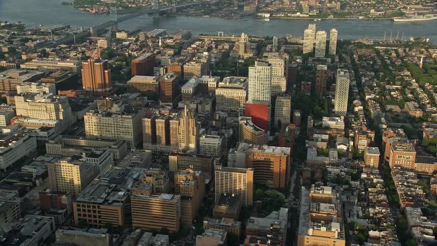 A beautiful aerial view of Philadelphias downtown area with office and apartment buildings during sunset