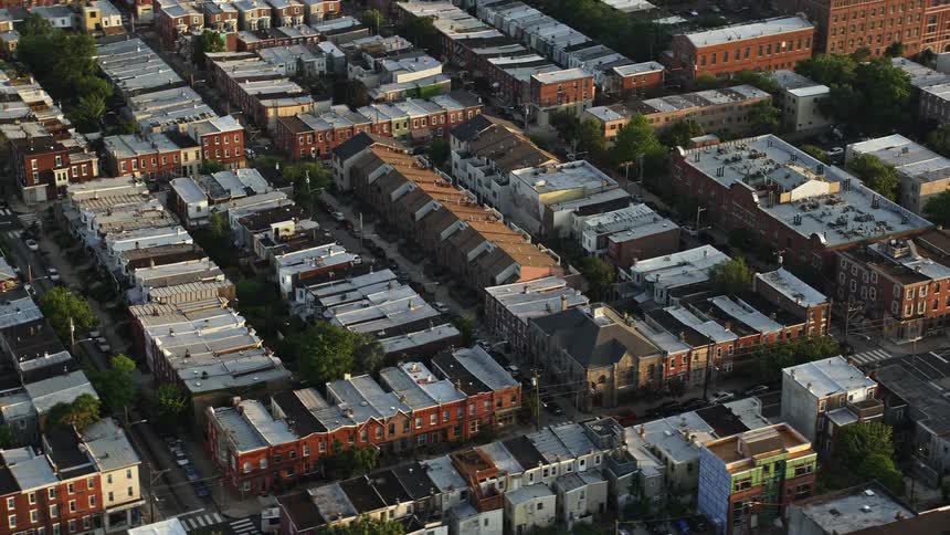 A stunning aerial view of row houses in North Philadelphia during sunset