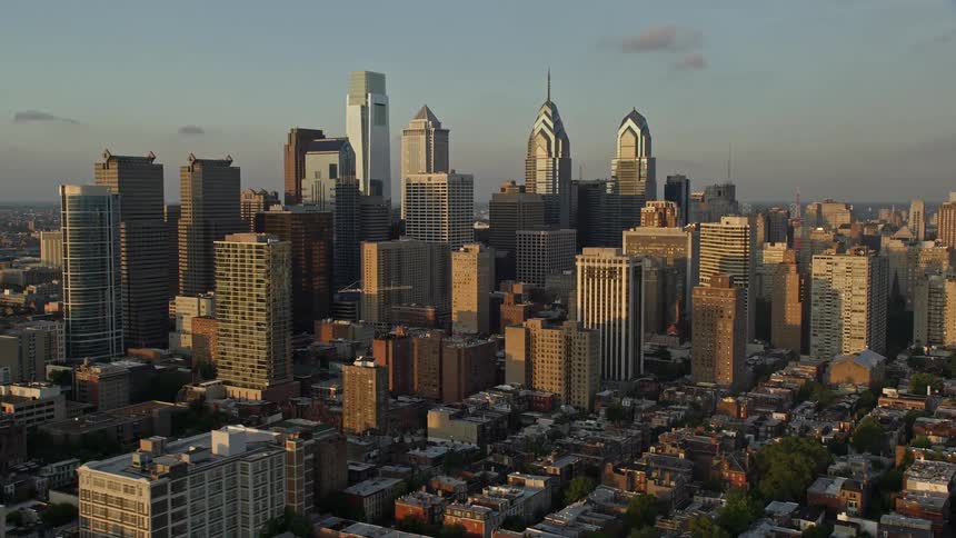 A stunning aerial view of Philadelphias downtown skyline at sunset featuring towering skyscrapers and high-rises