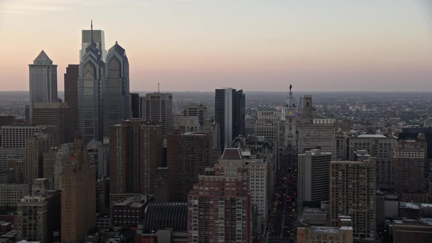 Aerial view of Downtown Philadelphia skyscrapers and City Hall during sunset