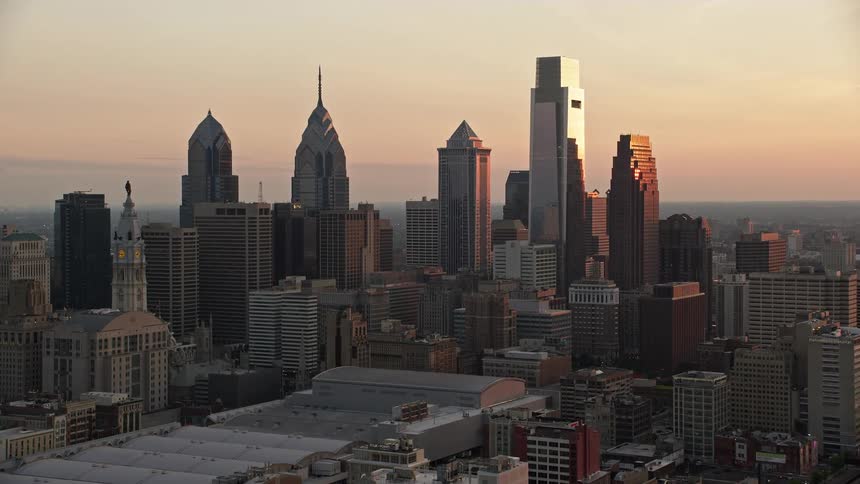 Approaching the tall and modern skyscrapers of downtown Philadelphia at sunset