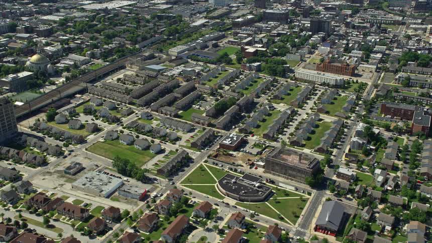 Aerial footage of North Philadelphias urban residential area showcasing apartment buildings homes and community centers