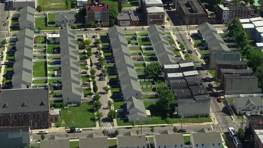 An aerial view of North Philadelphias suburban city showcasing townhouses and residential areas on a sunny day