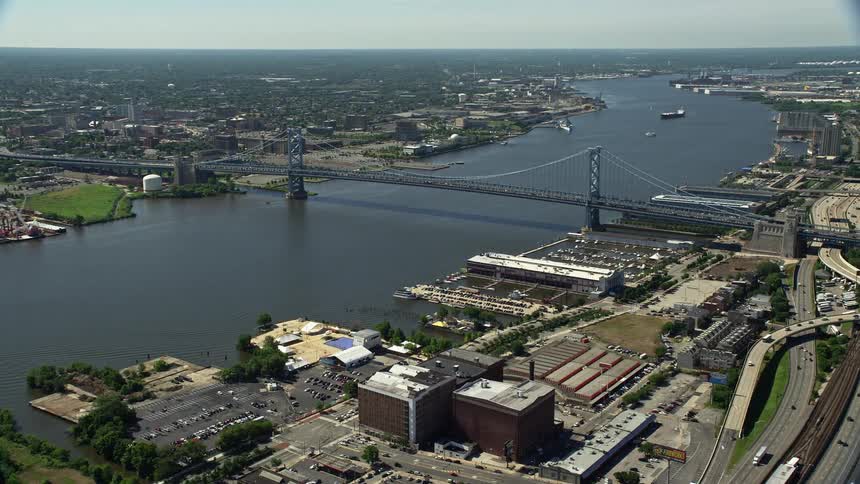 An aerial view of Benjamin Franklin Bridge and the Delaware River in Philadelphia Pennsylvania on a sunny day