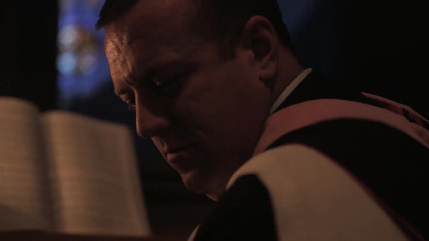 A man looks up from his music