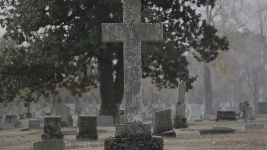 A cross is on a grave in this cemetery