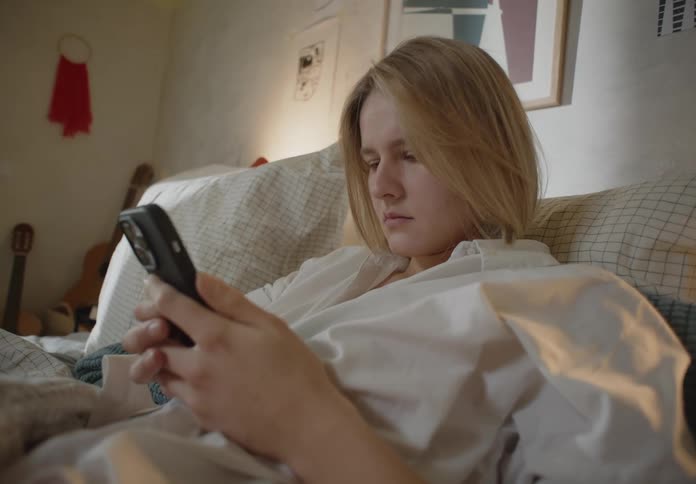 A woman is using a cell phone