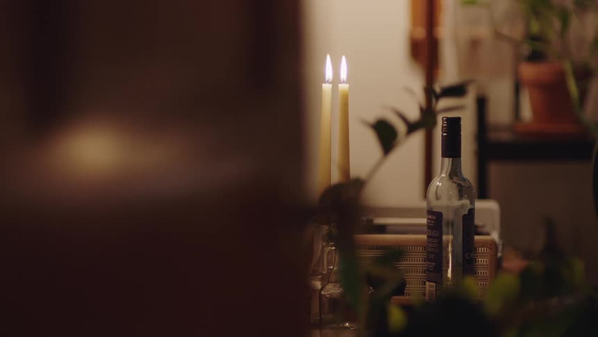 A bottle of wine is on the table