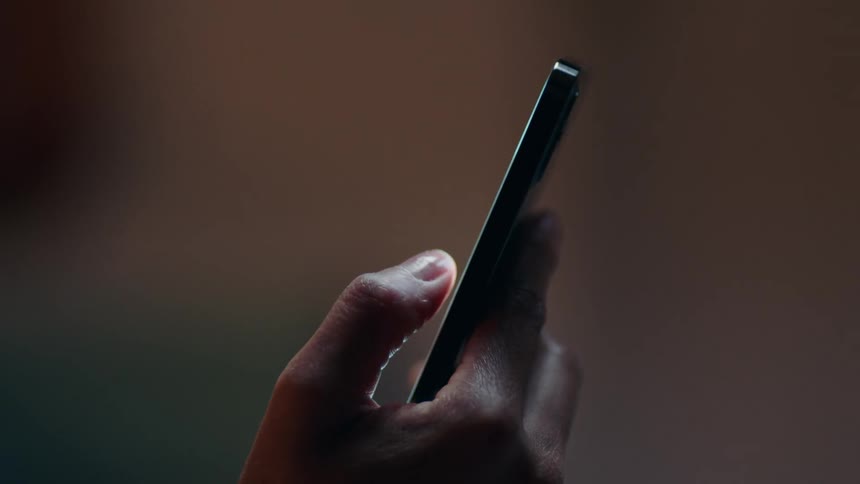 Close up view of a person texting on their phone