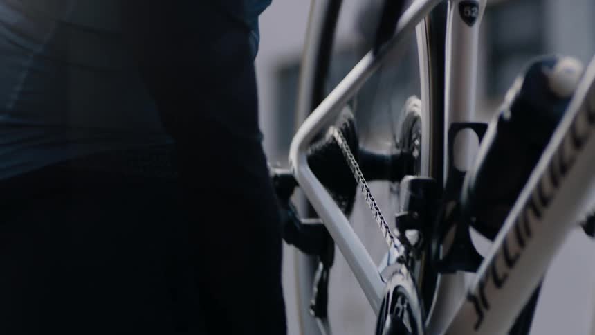 A man is about to ride his bike outside