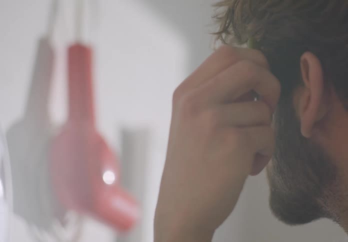 A man shaves his beard is doing his skincare routine