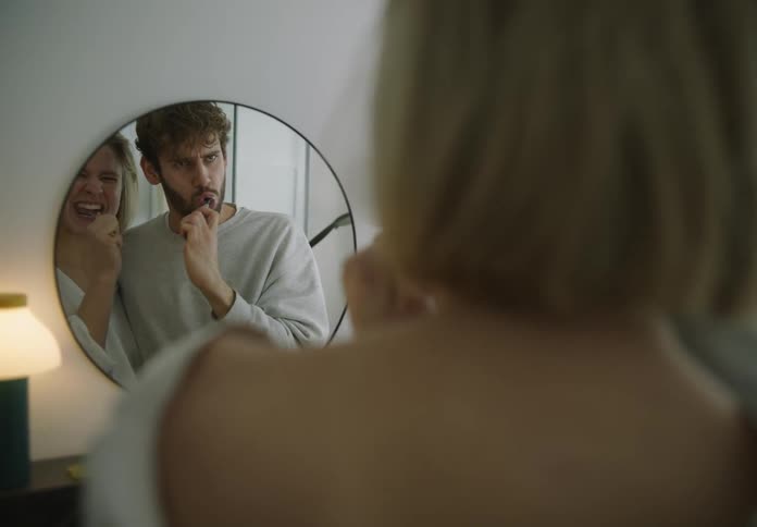 A young couple is brushing there teeth together in the bathroom