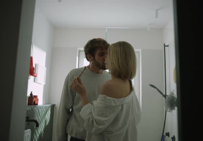 Young couple is brushing there teeth together in the bathroom