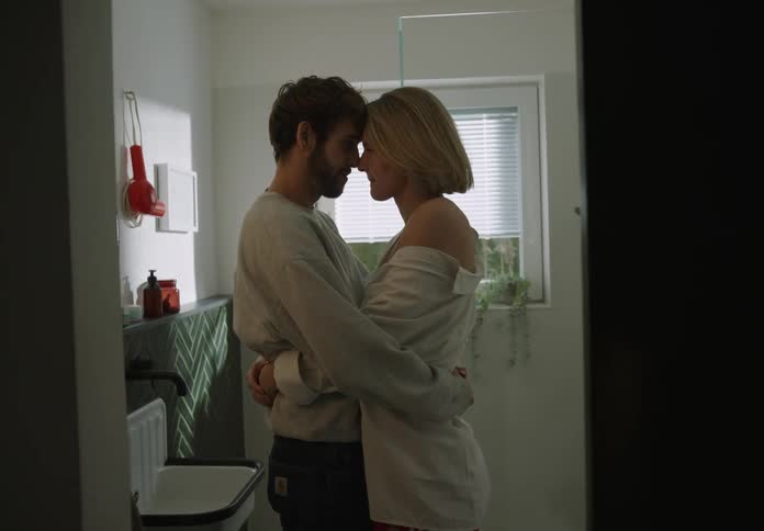 A young couple is being sentimental with each other