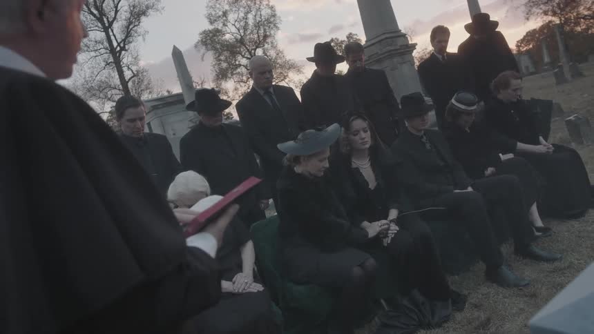 People are attending a funeral service