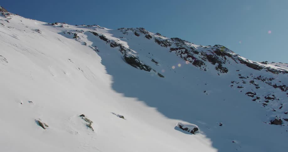 An aerial view of a snow covered mountain