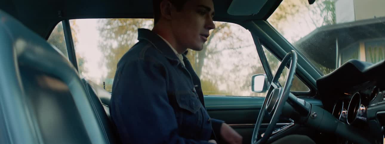 Excited man with denim jacket and pants looks and gets in car