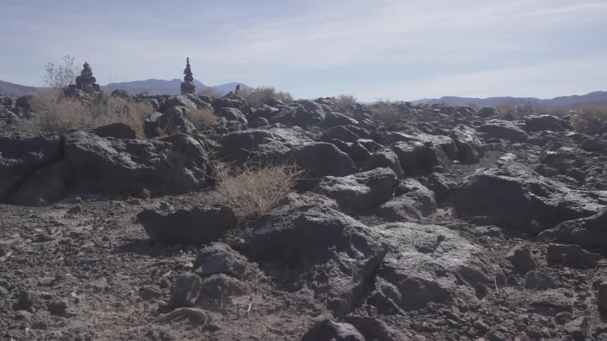 A hilly area is covered with large rocks