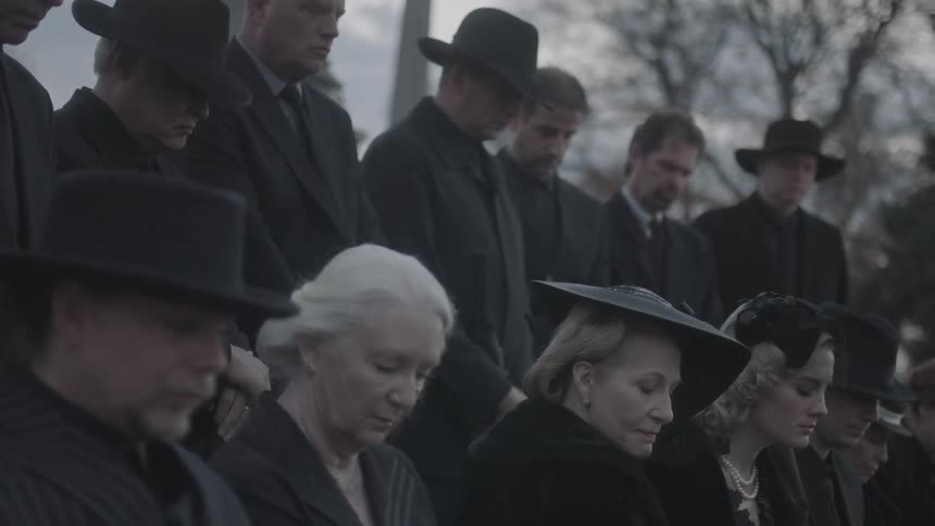 A group of people at a funeral
