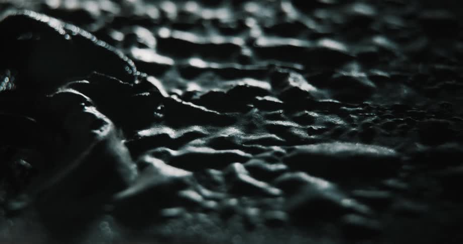 Tar bubbles on asphalt surface