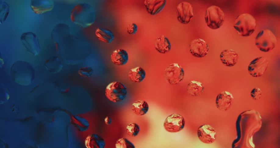 Water droplets on a window reflecting colors and lights