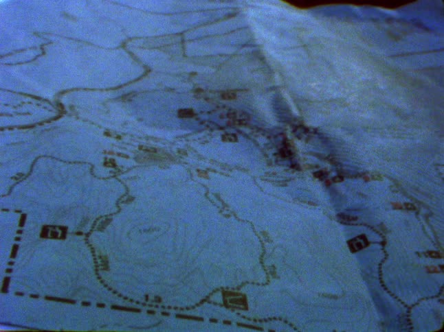A paper map is laid out flat