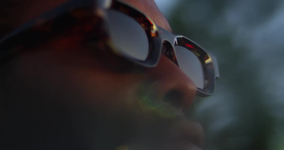 Side profile of man with sunglasses looking up