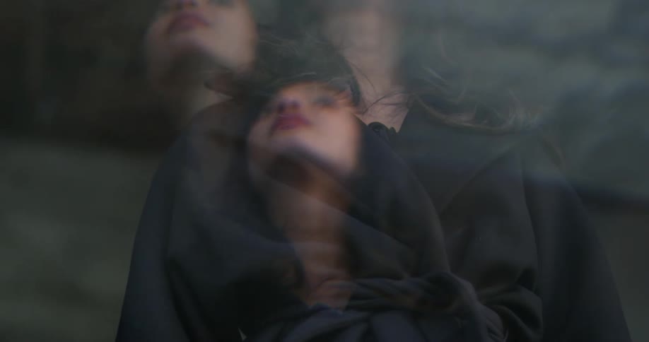 Multiple images of woman shifted a little overlap as she looks around