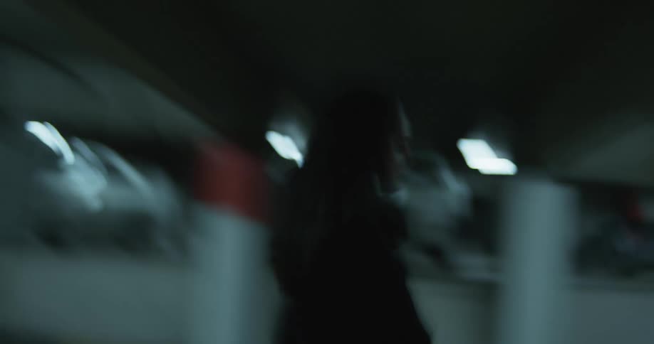 People walking around in a parking garage