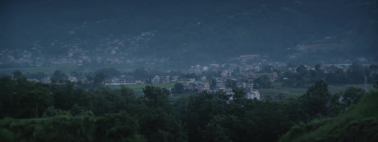 Traditional Nepalese Homes with Mountain Backdrop