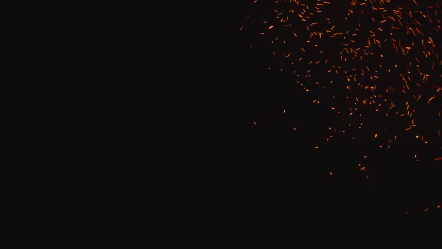 Sparking Brilliance: Scattering Welding Embers or Sparks Across a Black Background