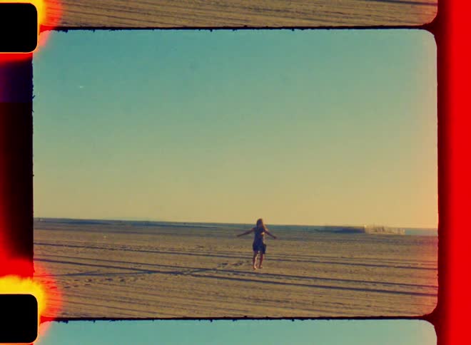 A woman walks on the beach
