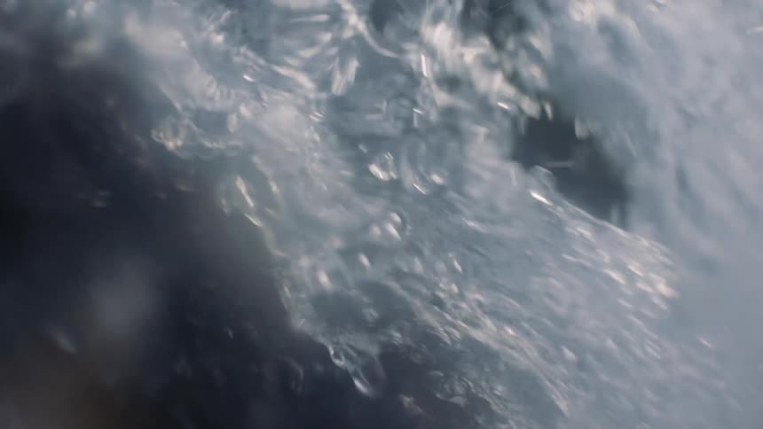 Splashing Waterfall: Intense Close-Up of Water Cascading over Rocks