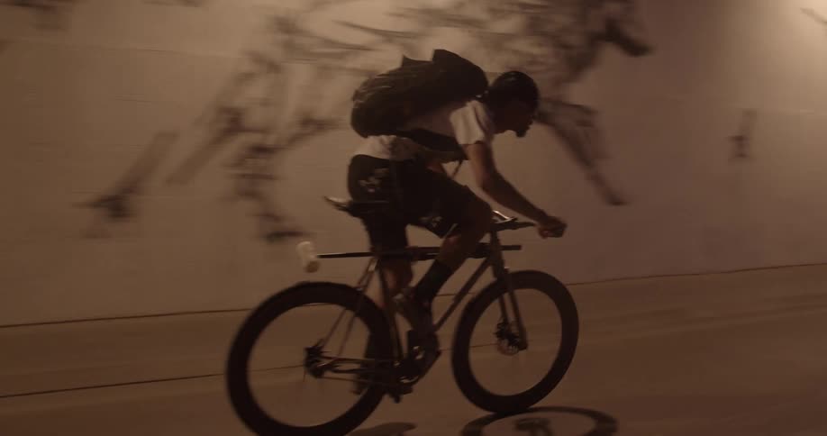 A man biking in a tunnel