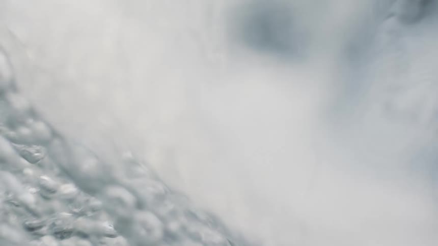 Underwater Serenity: Close-Up Clear Water Waves and Bubbles