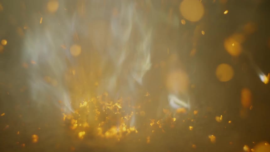 The view is of a fire and flame at night time