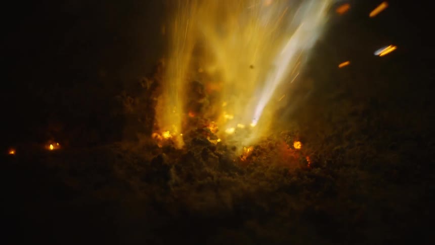 Smoke pours out of a fire