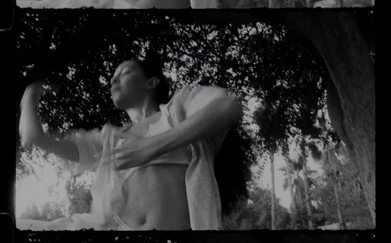 A young woman was dancing outdoors in the day time