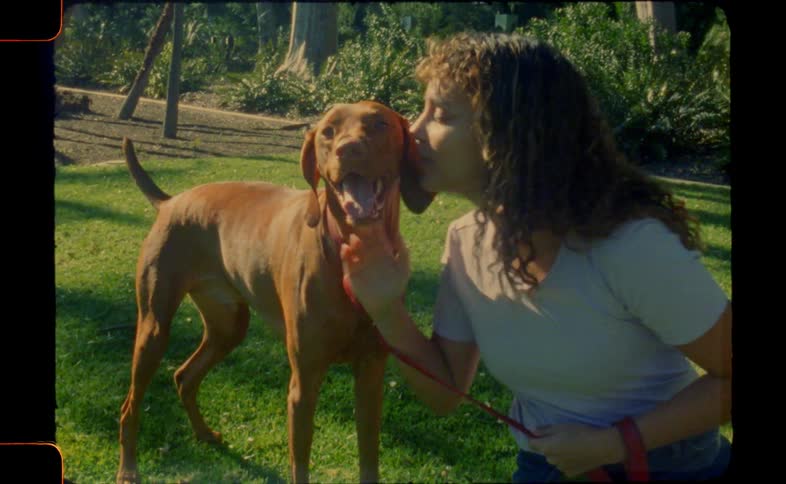 Woman playing with ehr dog