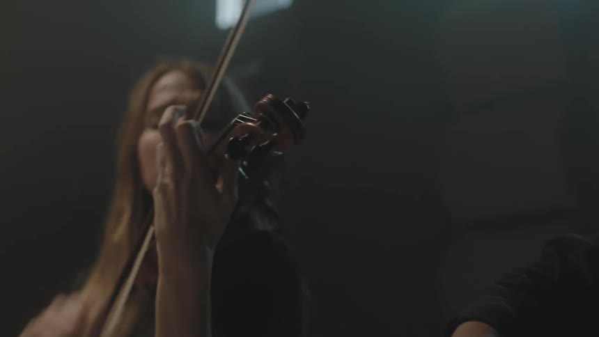 Woman passionately plays a violin