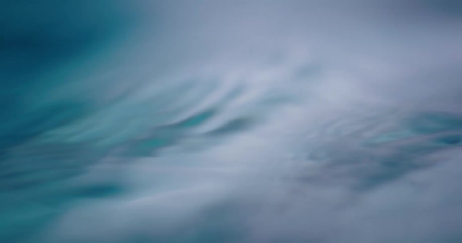 Close up of small ripples and waves on the surface of a boyd of clear water