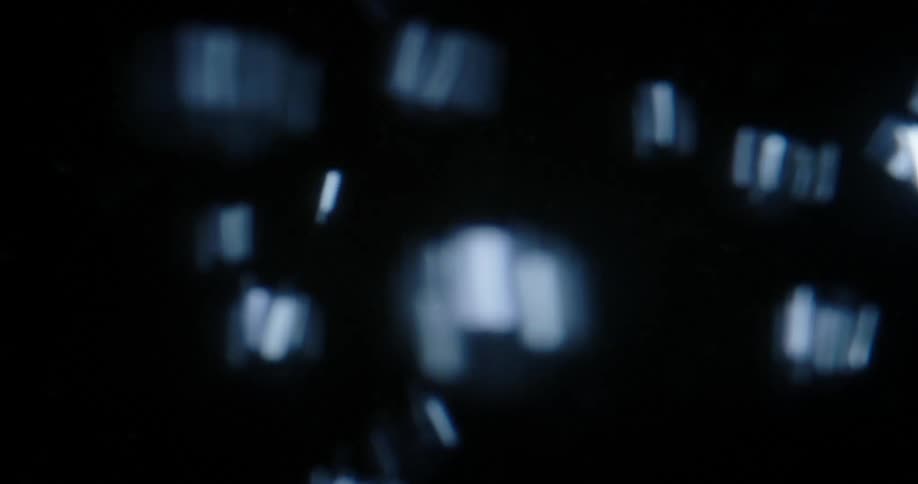 Lots of bubbles rise to the surface extremely fast against a black background
