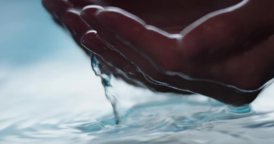 Hands scooping up water